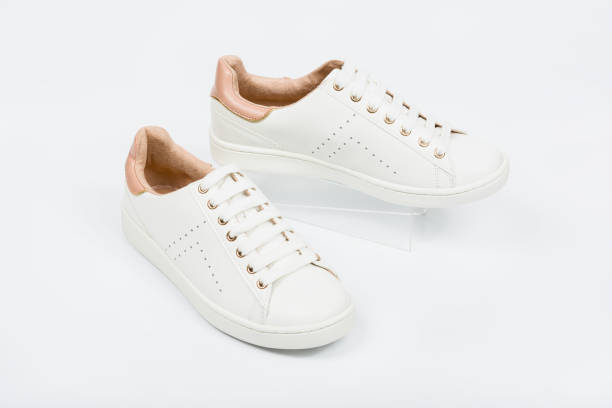 istock Women's sport leather shoes on white background 1013272872