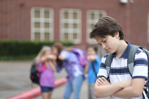 istock Pre-adolescent boy being bullied at school. 1013274970