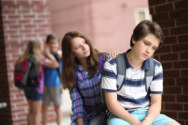 istock Comforting friend after being bullied. 1013275050