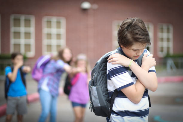 istock Pre-adolescent boy being bullied at school. 1013275106