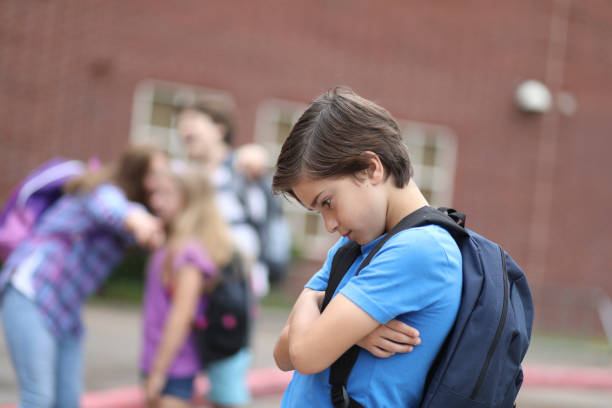 istock Elementary age boy being bullied at school. 1013275126
