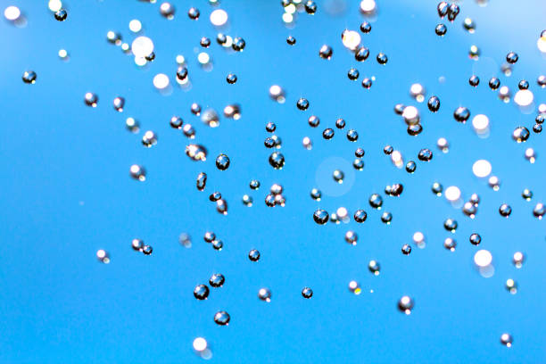 istock Close-up of water drops on glass surface as background 1013283722