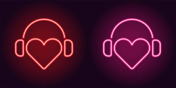 neon heart ze słuchawkami w kolorze czerwonym i różowym - valentines day hearts audio stock illustrations