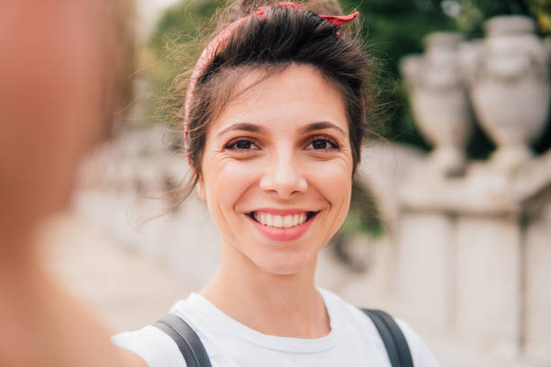 istock Beautiful young woman making a selfie and smiling 1013300440