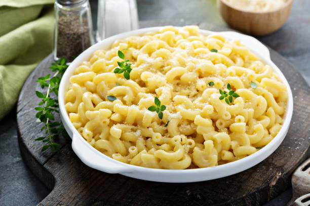 istock Macaroni and cheese on a white plate 1013334466