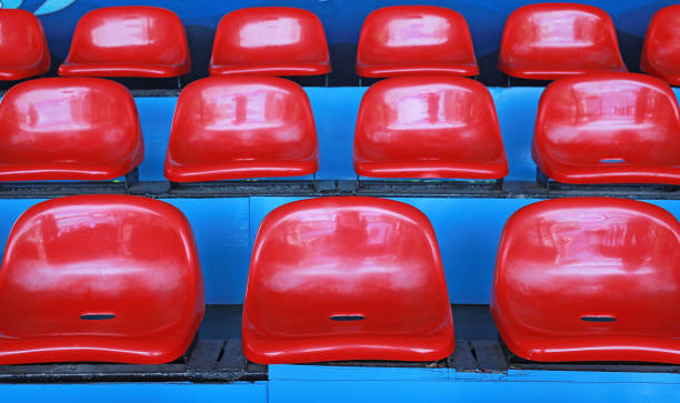 istock Red seats on the row at the stand. 1013371394