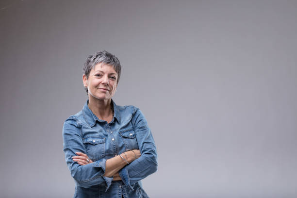 Confident senior woman with folded arms