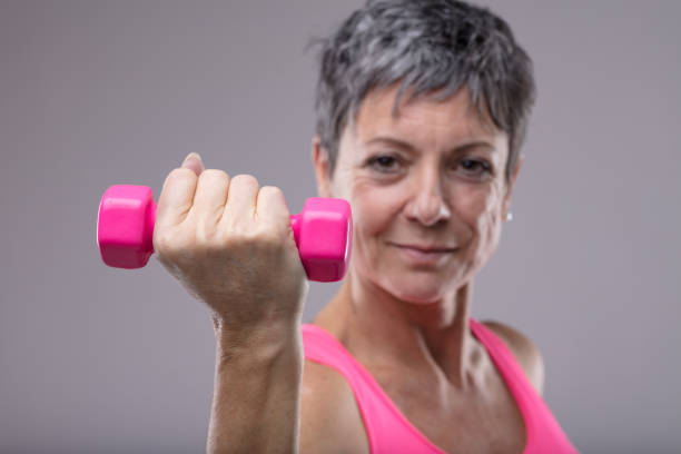 istock Fit determined woman working out with weights 1013413936