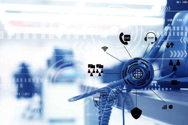 istock close up focus on call center headset device at headset VOIP system with virtual interface of futuristic symbol technology at office desk for hotline telemarketing and network operation concept 1013414182