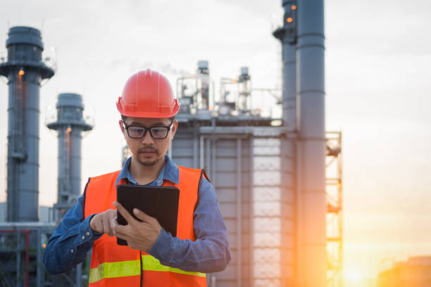istock Engineer working with tablet PC near power plant 1013414254