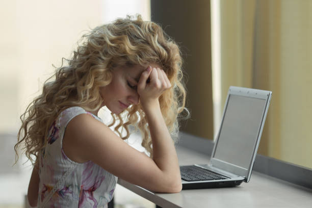 istock Frustrated and stressed woman at her laptop. 1013416576