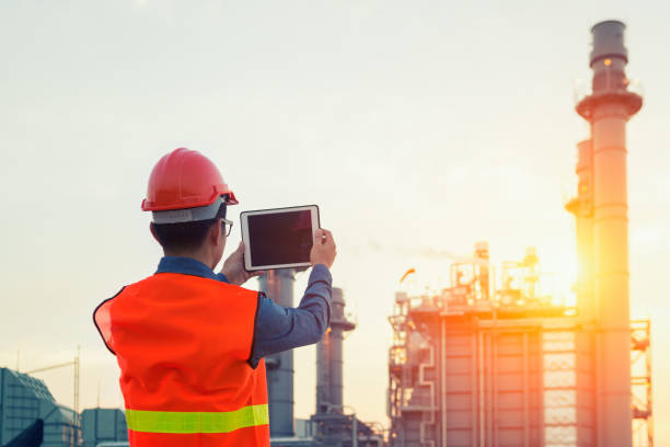istock Engineer working with tablet PC near power plant 1013416656