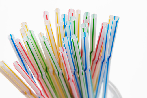 Plastic straws. Single use plastic, environmental issue, plastic pollution. Dining and party supplies.