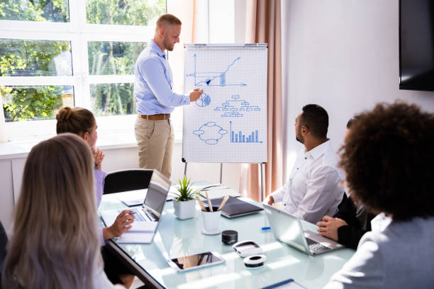 istock Businessman Giving Presentation In Office 1013419422