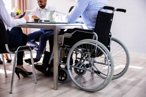 istock Disabled Businessman Sitting In Office 1013419462