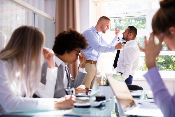 istock Two Male Colleagues Fighting In Office 1013419518
