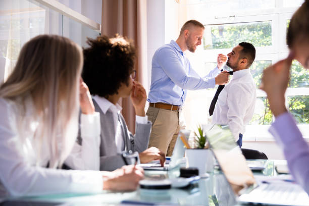 istock Two Male Colleagues Fighting In Office 1013419544