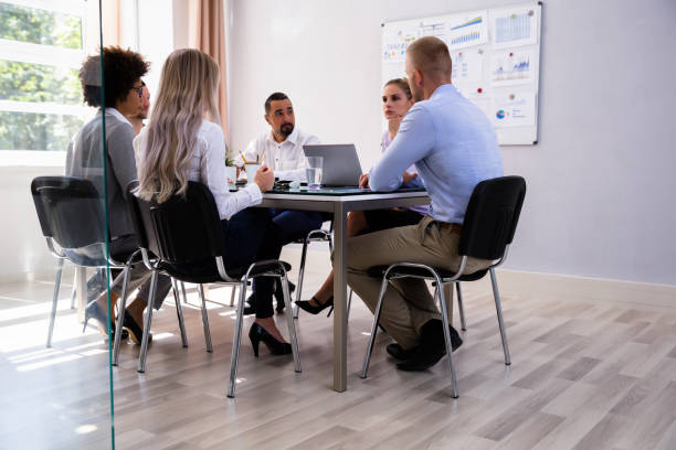 istock Group Of Businesspeople Sitting In Office 1013419546