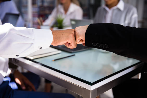 istock Two Businessmen Making Fist Bump 1013419584