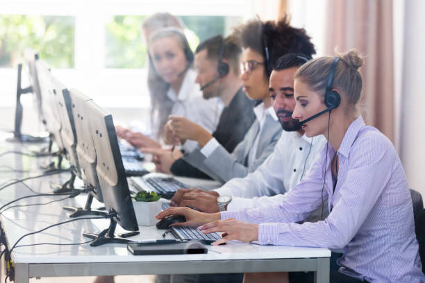 istock Customer Service Executives Working In Call Center 1013419706