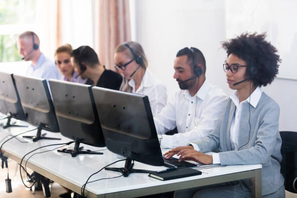 istock Customer Service Executives Working In Call Center 1013419714