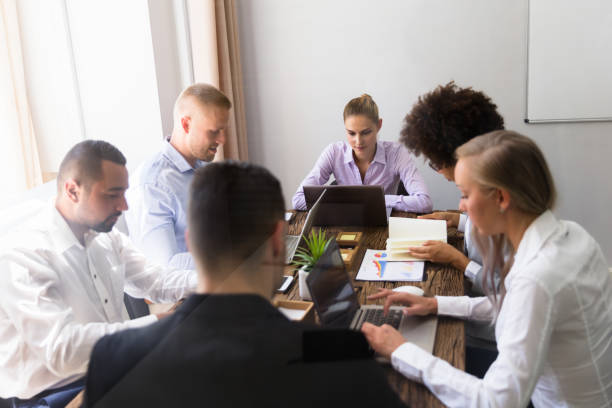 istock Group Of Businesspeople Sitting In Office 1013419794