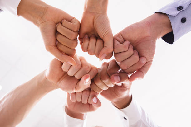 istock Businesspeople Making Fist Bump 1013422014
