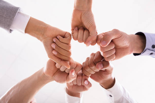 istock Businesspeople Making Fist Bump 1013422018