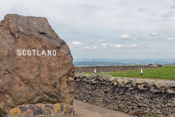 istock Border between England and Scotland at Carter Bar with rock 1013424758