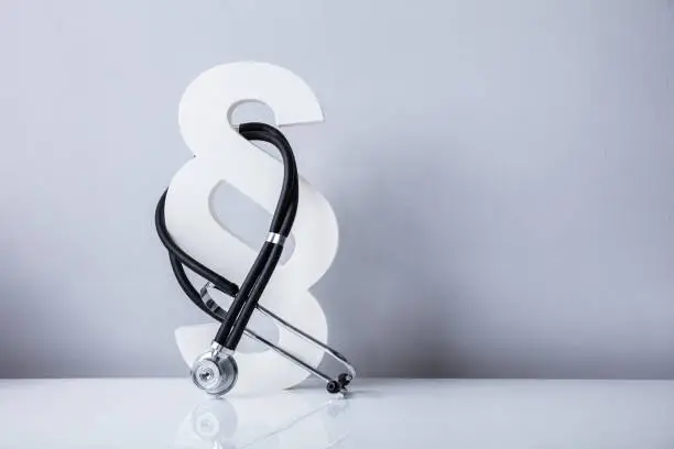 Photo of Close-up Of Stethoscope And Paragraph Symbol