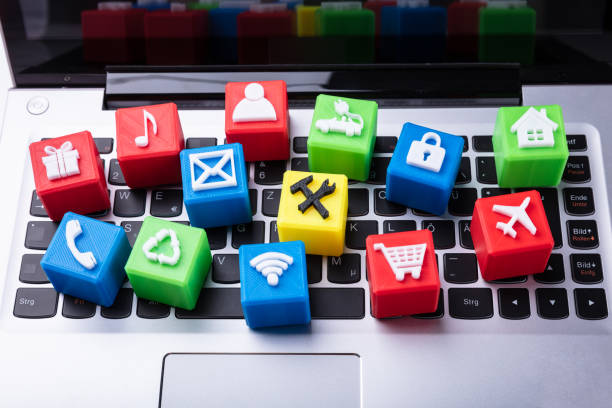 Elevated View Of Colorful Vivid Icons Cubic Blocks On Laptop Keypad