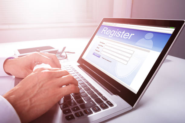 Businessman Filling Online Registration Form Businessman's Hand Filling Online Registration Form On Laptop register stock pictures, royalty-free photos & images