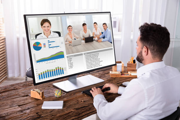 istock Businessman Video Conferencing With His Colleagues On Computer 1013435462
