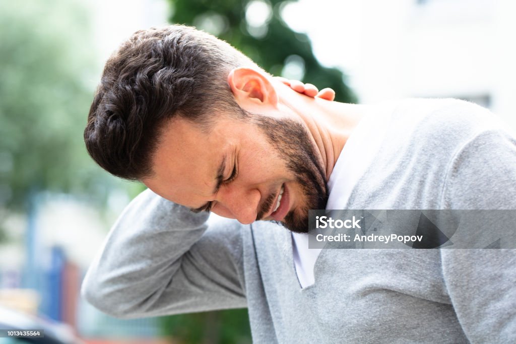 Man Suffering From Neck Pain Young Man Having Pain In His Neck Neckache Stock Photo