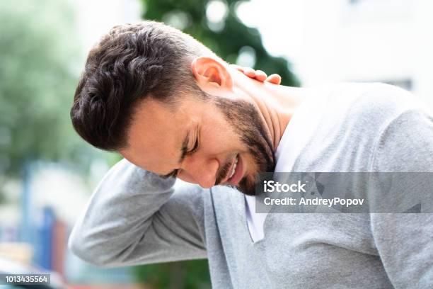 Man Suffering From Neck Pain Stock Photo - Download Image Now - Neckache, Adult, Adults Only