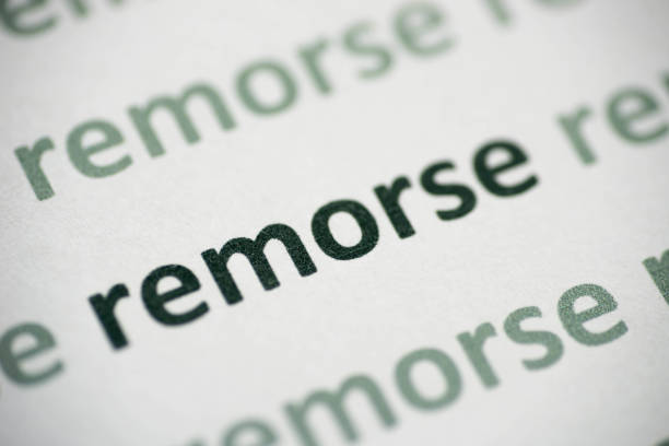 istock word remorse  printed on paper macro 1013437886