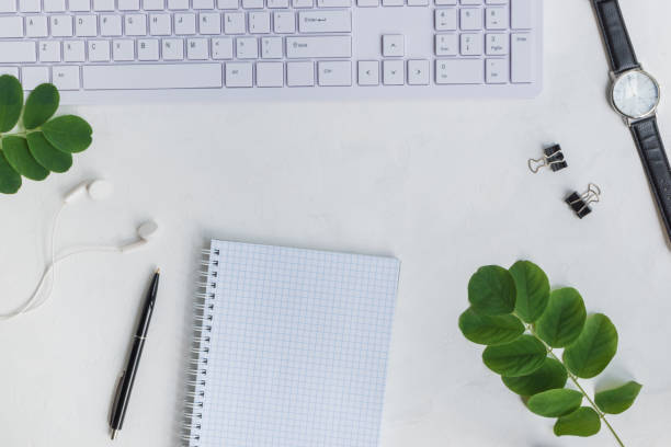 istock Blogger or freelancer workspace with notebook and green leaves 1013438040
