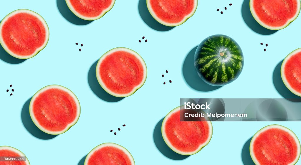 One out unique watermelons arranged One out unique watermelons arranged on a blue background Watermelon Stock Photo