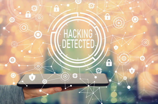 istock Hacking detected with man holding a tablet 1013440382