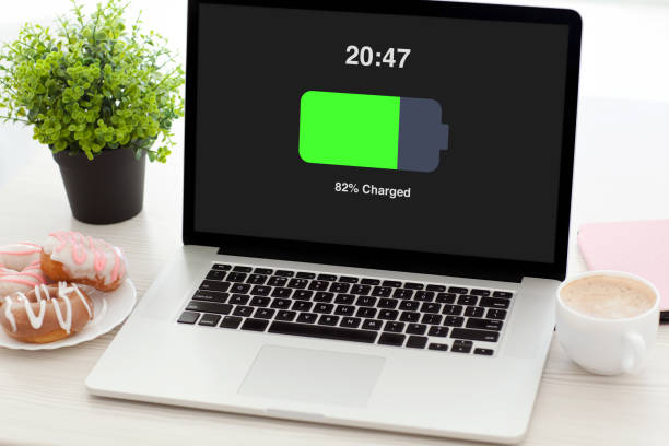 istock notebook with charged battery screen on desk in office 1013445348