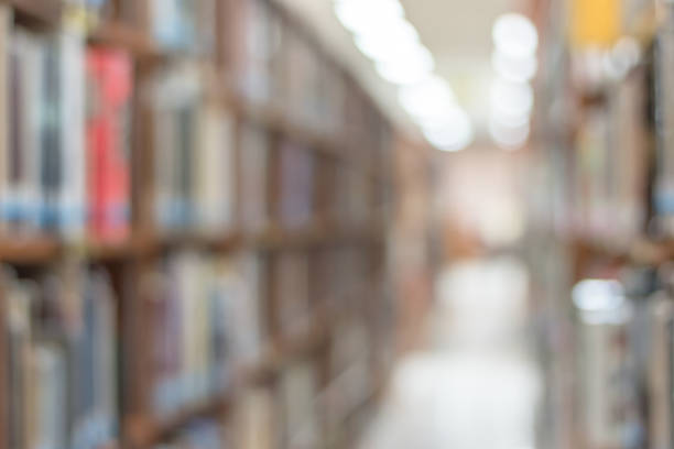 istock Blur school library or study room with book shelves for education background 1013458028