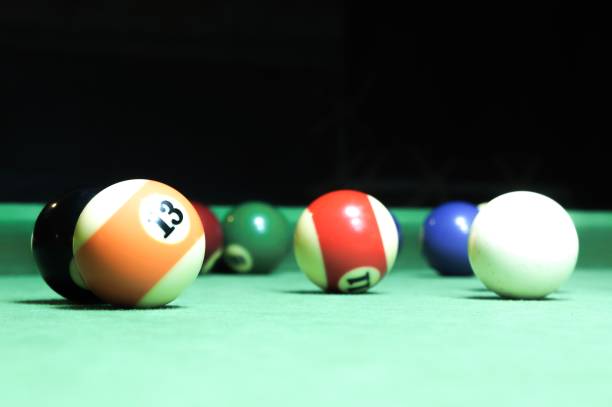 istock Billiards balls on a green board 1013458290