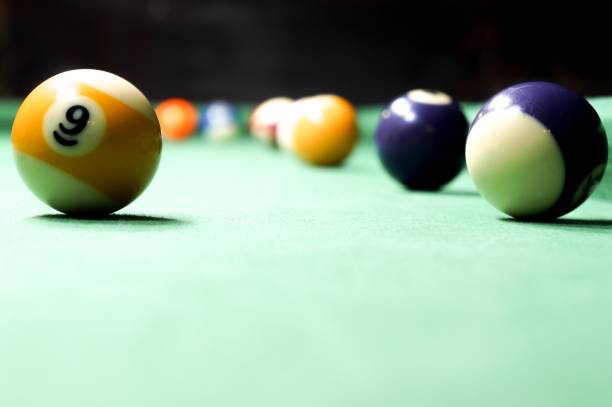 istock Billiards balls on a green board 1013458294
