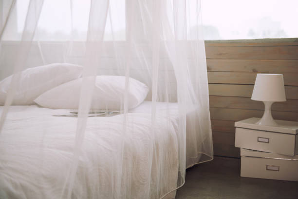 Bedroom interior with white beddings in apartment, nobody stock photo