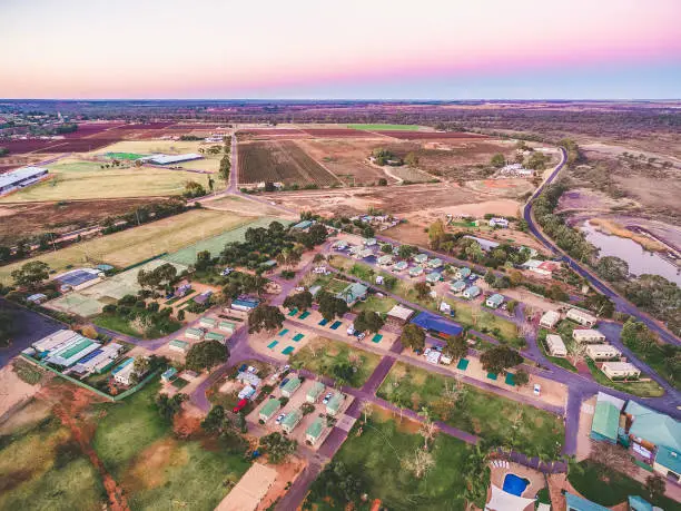 Aerial landscape of holiday park on shore of Murray River at dusk in Berri, South Australia
