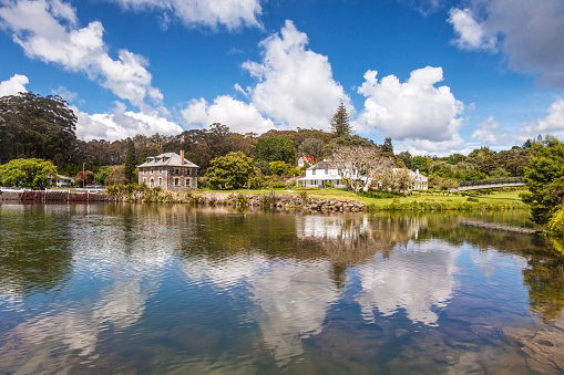 New Zealand's oldest stone building, the Stone Store at Kerikeri, Bay of Islands. Kerikeri in Northland is one of the earliest European settlements in New Zealand. This view is of the Stone Store, St James' Church and the Mission House or Kemp House, across the Kerikeri River.
