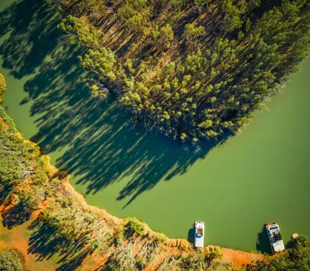 Looking down at moored houseboats on shores of beautiful Murray River in South Australia