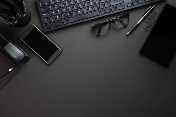 istock Office Supplies With Computer Keyboard On Gray Desk 1013506874