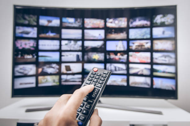 istock Hand pressing remote of smart tv 1013520992
