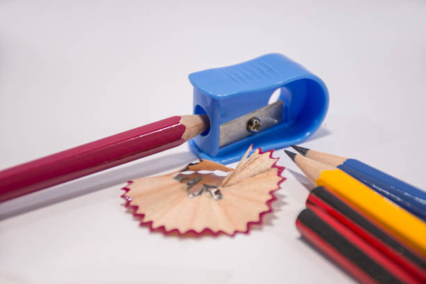 istock Pencil with sharpening shavings on white background,Students sharpen the pencil with a pencil sharpener 1013521966